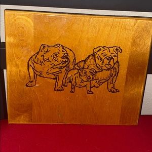 Wooden portrait of some bulldogs